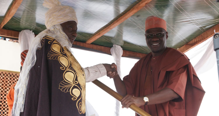 Kwara State Governor, Dr. Abdulfatah Ahmed (left) Congratulating the New Emir of Ilesha Baruba, Prof. Halidu Abubakar during the presentation of 2nd Class Staff of Office at Ilesha Baruba in Baruten LGA...Wednesday.